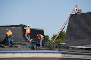 roof contractors can help with hauling away asphalt shingles for recycling