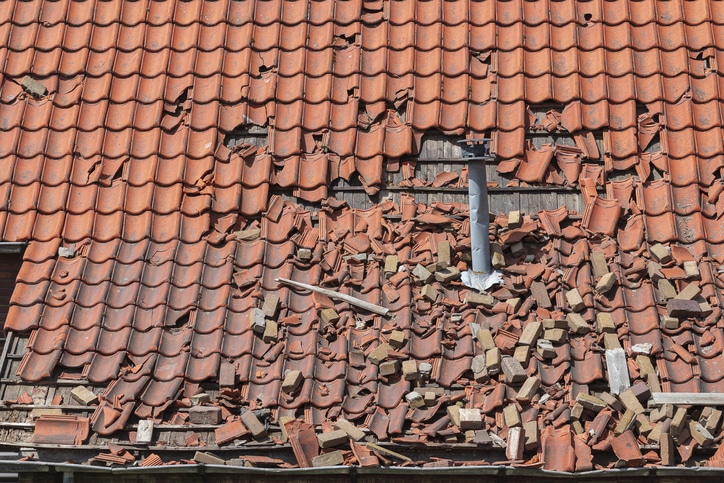 wind damage can rip and destroy shingles right off your roof